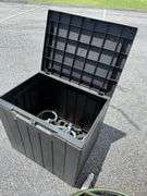 Outdoor Storage Box with Assorted Garden Hoses and Accessories