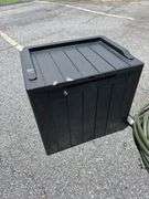 Outdoor Storage Box with Assorted Garden Hoses and Accessories