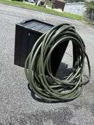 Outdoor Storage Box with Assorted Garden Hoses and Accessories