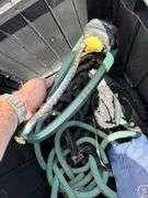 Outdoor Storage Box with Assorted Garden Hoses and Accessories