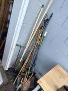 Assorted Garden Tools: Shovels, Rakes, Hedge Trimmers, and More