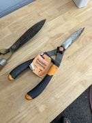 Assorted Garden Tools: Shovels, Rakes, Hedge Trimmers, and More