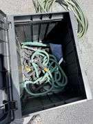 Outdoor Storage Box with Assorted Garden Hoses and Accessories
