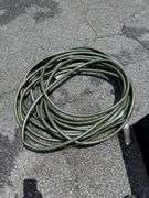 Outdoor Storage Box with Assorted Garden Hoses and Accessories