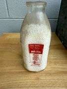 Collection of Glass Milk Bottles with Wooden Crate