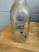 Collection of Glass Milk Bottles with Wooden Crate