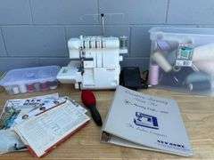Singer Ultralock Serger Sewing Machine with Accessories and Sewing Patterns