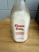 Collection of Glass Milk Bottles with Wooden Crate