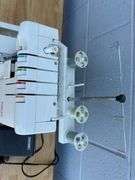 Singer Ultralock Serger Sewing Machine with Accessories and Sewing Patterns