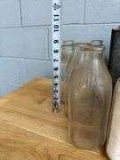 Collection of Glass Milk Bottles with Wooden Crate