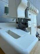 Singer Ultralock Serger Sewing Machine with Accessories and Sewing Patterns