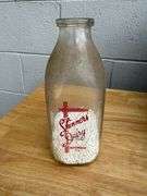 Collection of Glass Milk Bottles with Wooden Crate