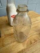 Collection of Glass Milk Bottles with Wooden Crate