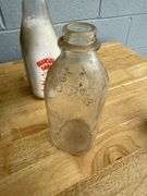 Collection of Glass Milk Bottles with Wooden Crate