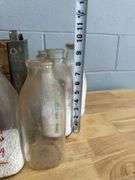 Collection of Glass Milk Bottles with Wooden Crate