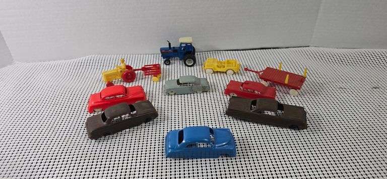Collection of miscellaneous plastic cars and die cast tractor. image