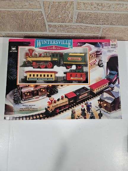 Winter express battery operated train and wind-up tooting locomotive image