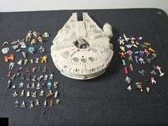 1995 Star Wars Micro Machines Millennium Falcon playset with figurines.