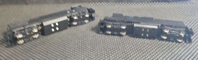 Two Unbranded Black Powered Locomotives
