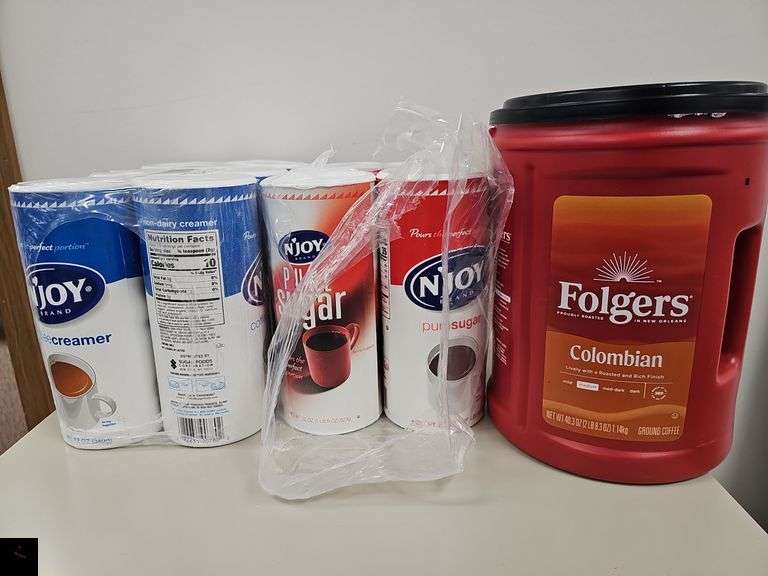 Unopened Folgers ground coffee, sugar and creamer