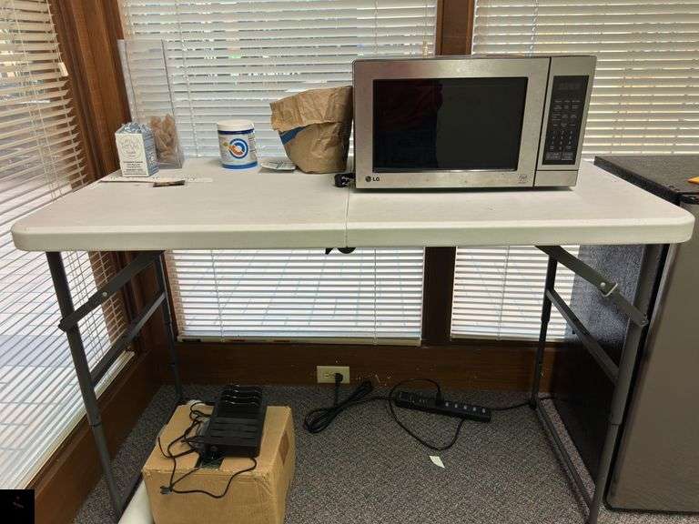 Four-foot long plastic folding table with adjustable height legs (table only - contents listed separately)