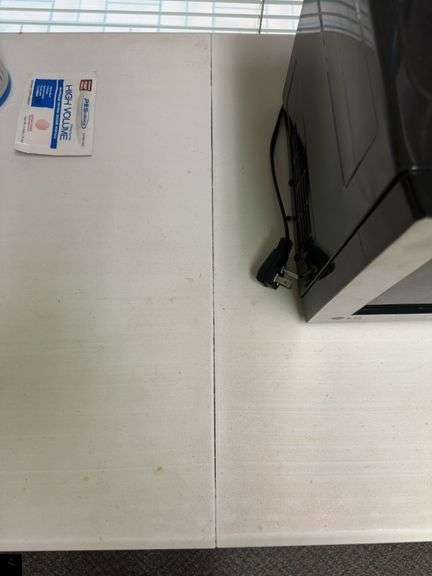Four-foot long plastic folding table with adjustable height legs (table only - contents listed separately)