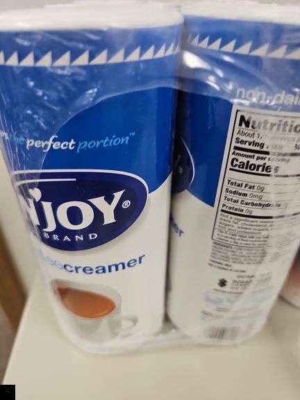 Unopened Folgers ground coffee, sugar and creamer