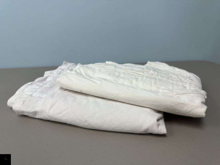 Two old sheets for drop cloth or furniture protection