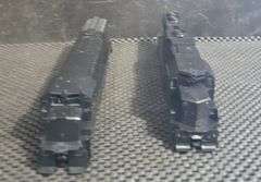 Two Unbranded Black Powered Locomotives