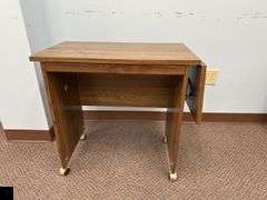 Rolling credenza with drop leaf side