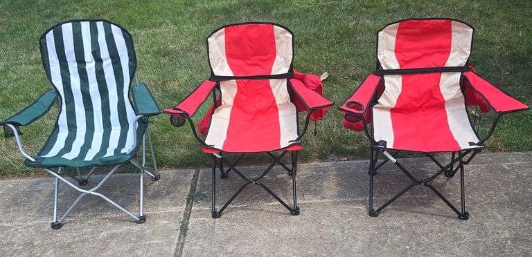 Three folding chairs. Two Red chairs have the carry bags.