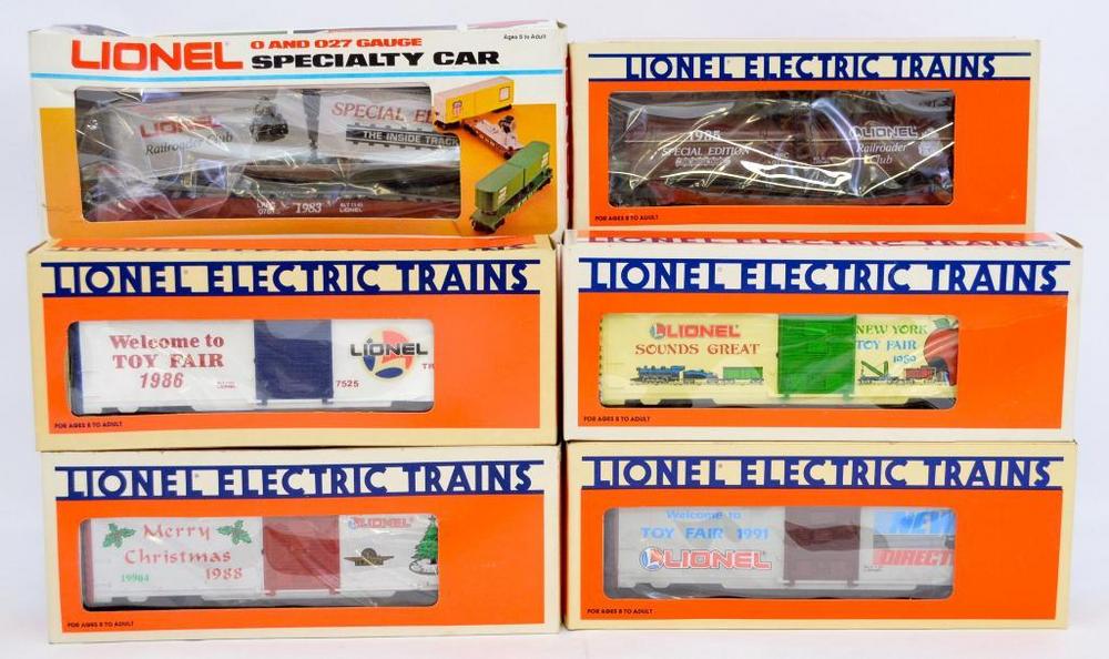 Six Lionel O gauge Toy Fair and Christmas cars in original boxes