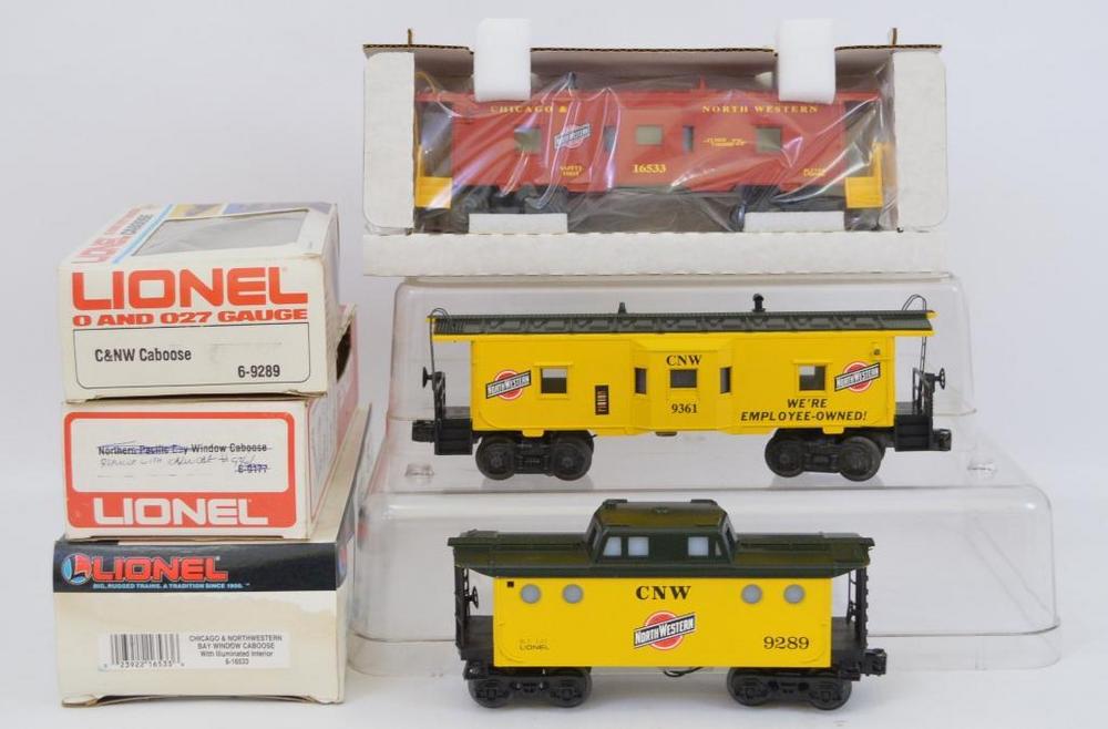 Three Lionel O gauge Chicago & Northwestern caboose in original boxes