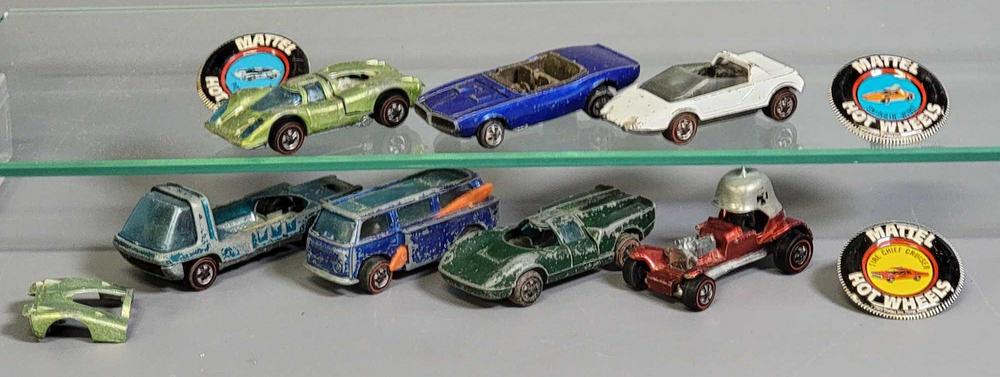 Group of seven filler Hot Wheels Redline cars with some buttons