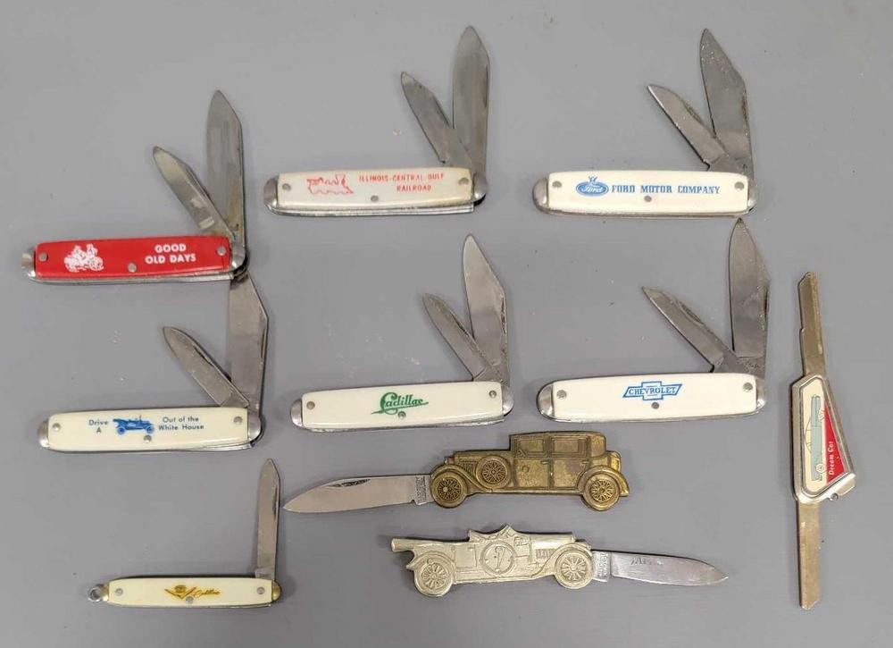 Group of old automobile and railroad advertising pocket knives