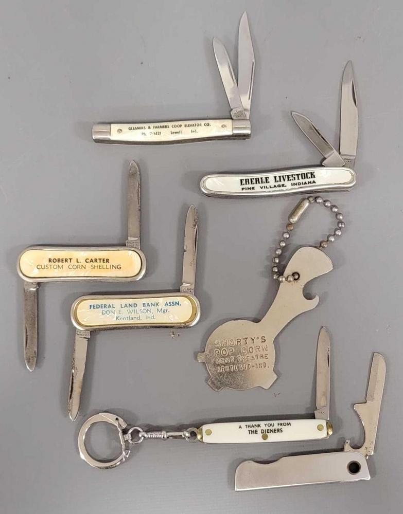 Group of seven old advertising pocket knives