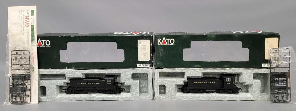 Two identical Kato HO scale Pennsylvania EMD NW2 diesel switchers in original boxes