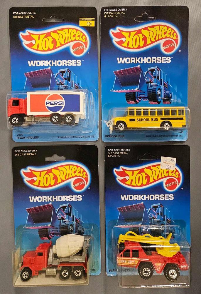 Four blackwall Hot Wheels Workhorses on blister cards