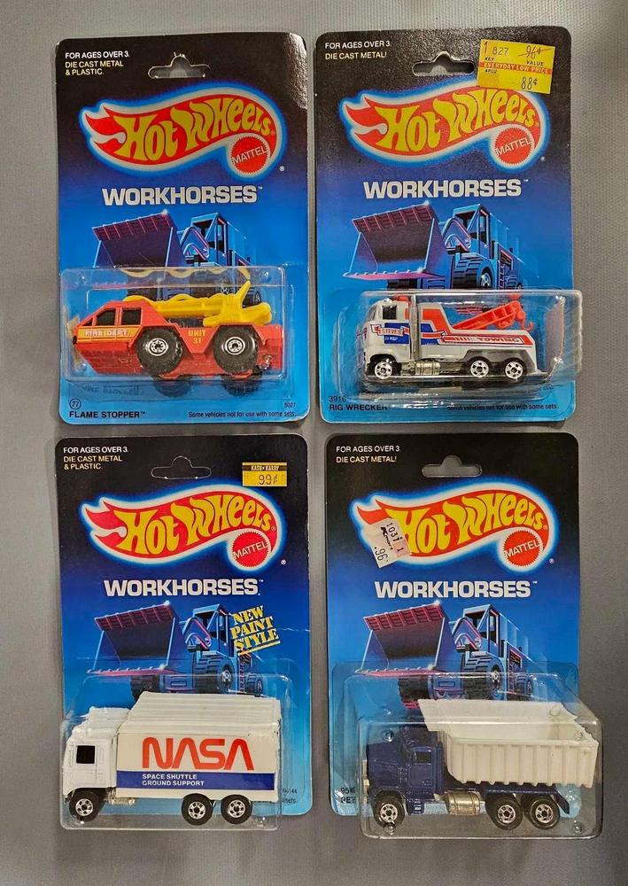 Four blackwall Hot Wheels Workhorses on blister cards with nubs