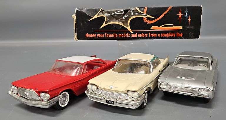 Three vintage promo cars with one original box image