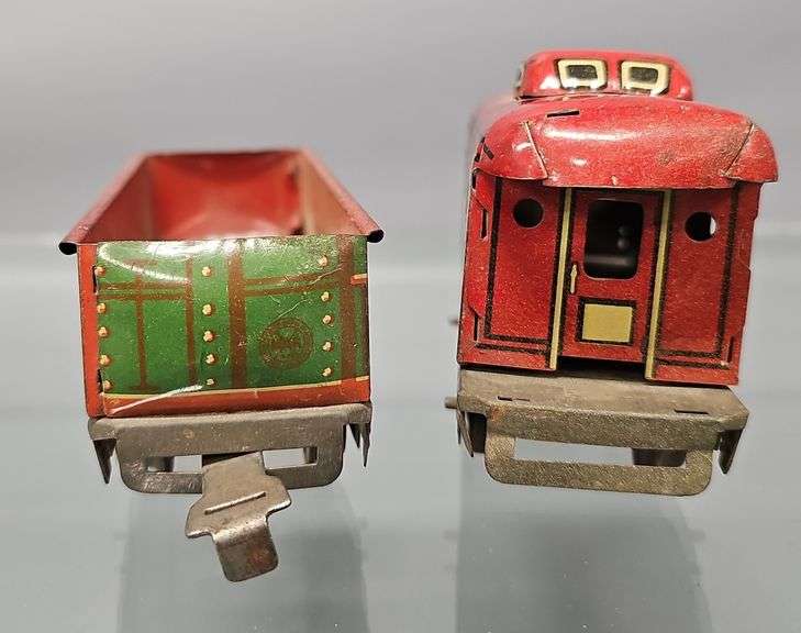 Two Marx O gauge freight cars with unpainted frames