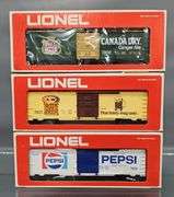 Three Lionel MPC era O box cars in original boxes