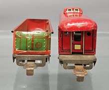 Two Marx O gauge freight cars with unpainted frames