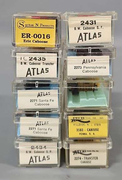 Ten Atlas N Scale Cabooses in Clear Cases