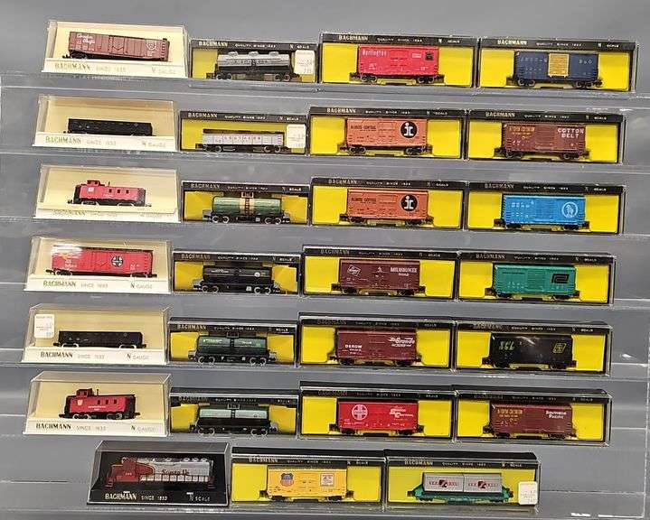 Twenty-seven Bachmann N Scale Freight Cars with one Diesel Locomotive in Clear Cases