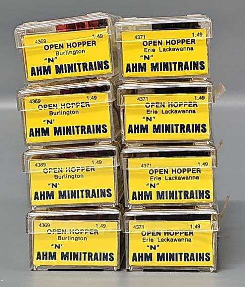 Eight AHM Minitrains N Scale Open Hopper Cars in Clear Cases