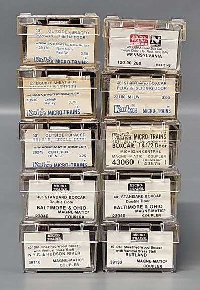 Ten Kadee Micro-Trains N Scale Box cars in Clear Cases