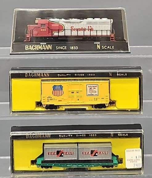 Twenty-seven Bachmann N Scale Freight Cars with one Diesel Locomotive in Clear Cases