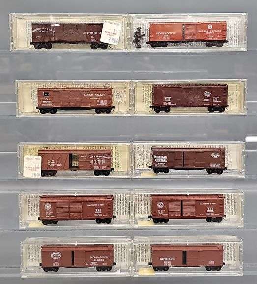 Ten Kadee Micro-Trains N Scale Box cars in Clear Cases