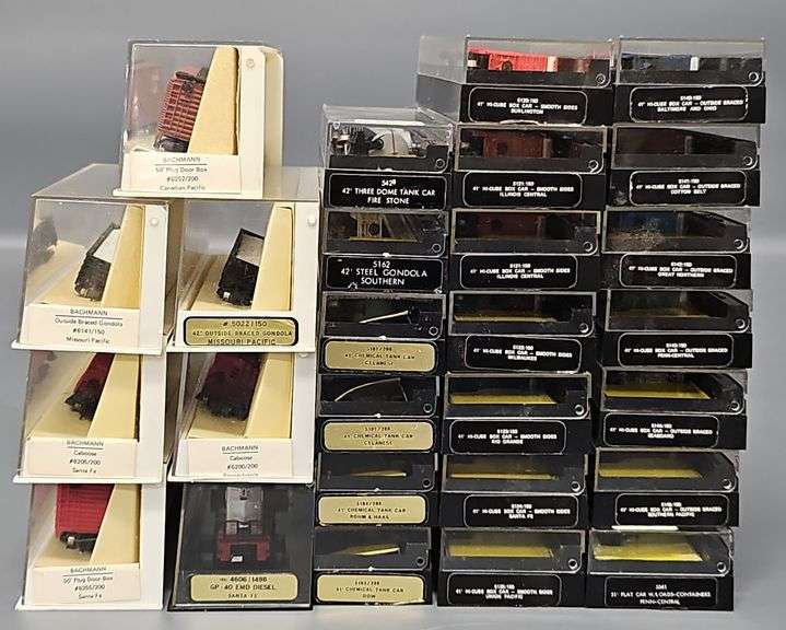 Twenty-seven Bachmann N Scale Freight Cars with one Diesel Locomotive in Clear Cases